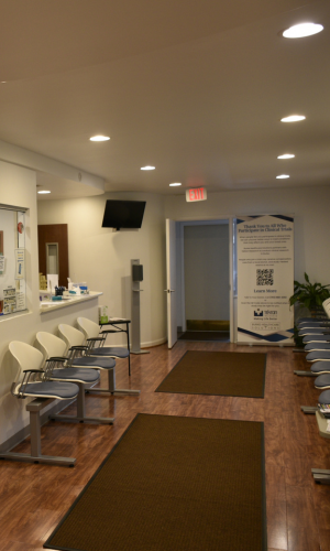 Close-up of a healthcare provider comforting a patient